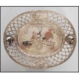 A 19th Century continental silver dish having raised pierced openwork sides with floral swags and
