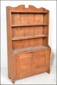A Victorian 19th century country pine open window bookcase cabinet having shaped uprights with