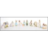 A collection of eleven Beswick Beatrix potter figurines to include Mrs Rabbit, Cecily Parsley, Hunca