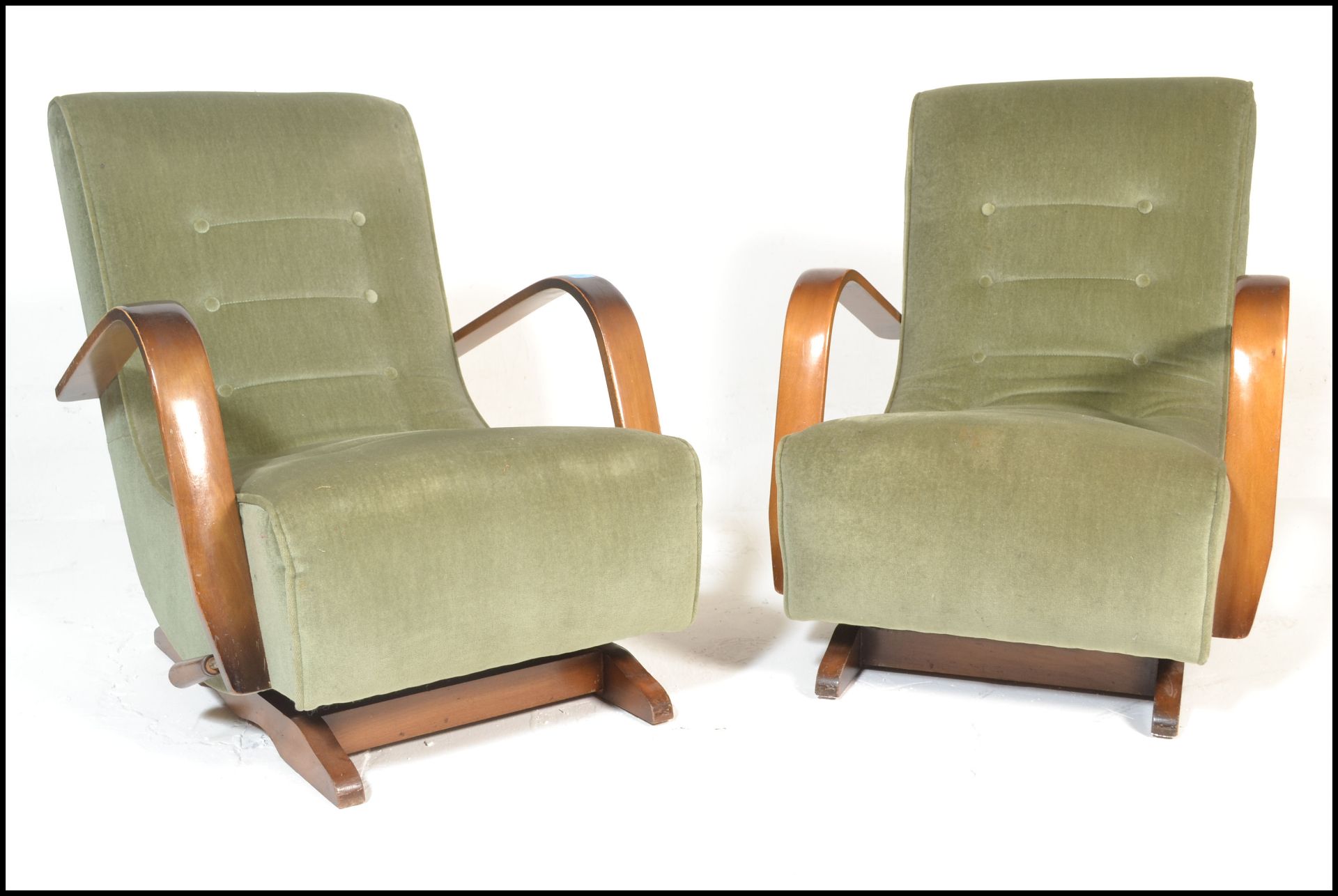 A pair of early 20th century, circa 1940's bentwood rocking chairs - armchairs. Raised on beech wood
