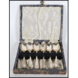 A boxed set of six 19th Century Victorian Wakely & Wheeler silver tea spoons chase decorated