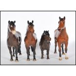 A collection of four Beswick ceramic figurines modelled as horses to include a Shetland pony, a