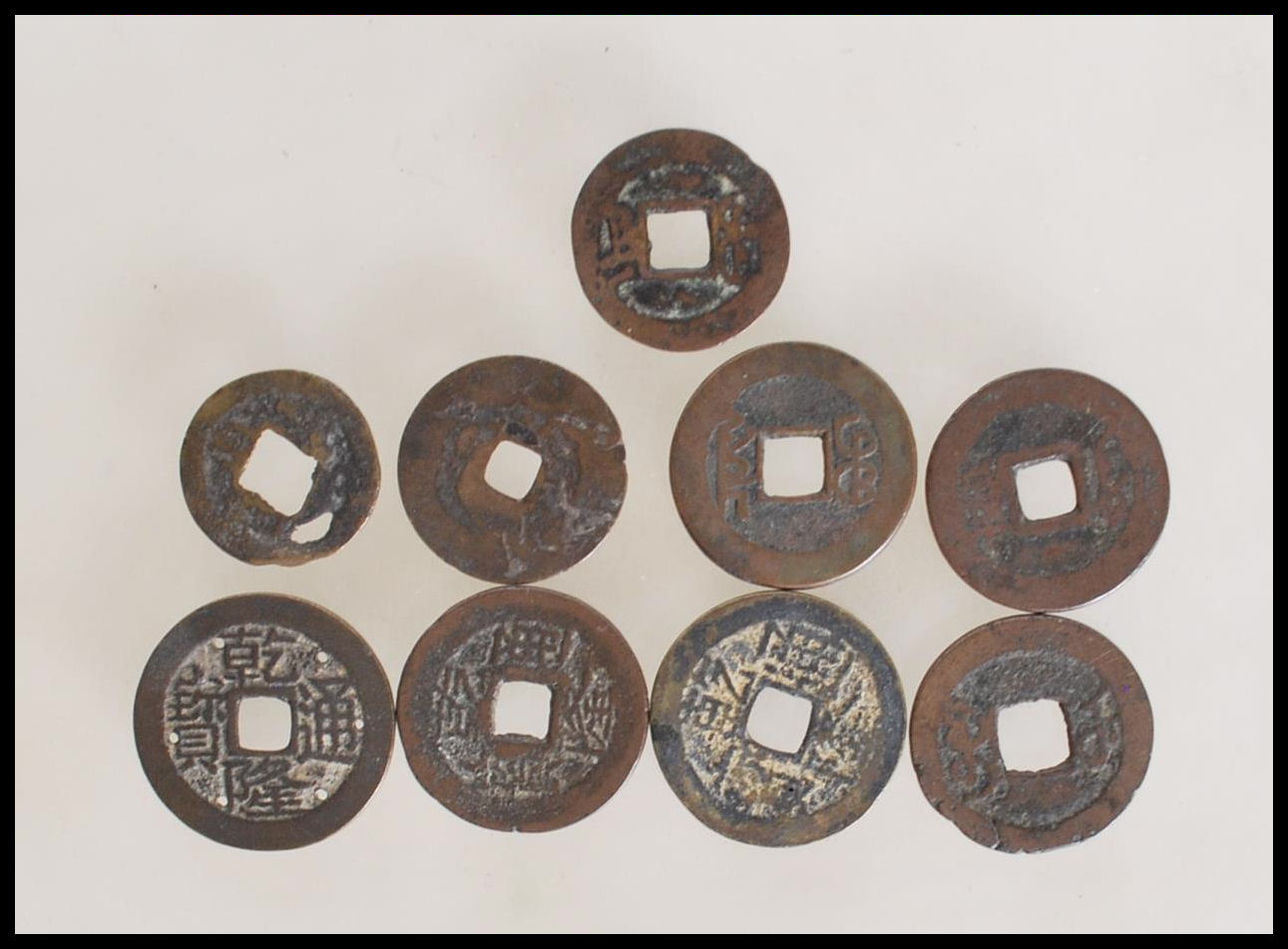 A group of nine Chinese tang dynasty coins having square pierced centres. Nine in total. - Image 2 of 7