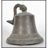 A 20th Century cast metal bell having floral relief decoration to the borders, having a right angled