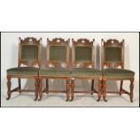 A set of 4 late Victorian 19th century oak Arts & Crafts manner dining chairs. Raised on turned legs