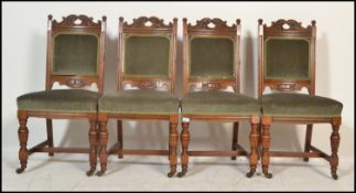 A set of 4 late Victorian 19th century oak Arts & Crafts manner dining chairs. Raised on turned legs