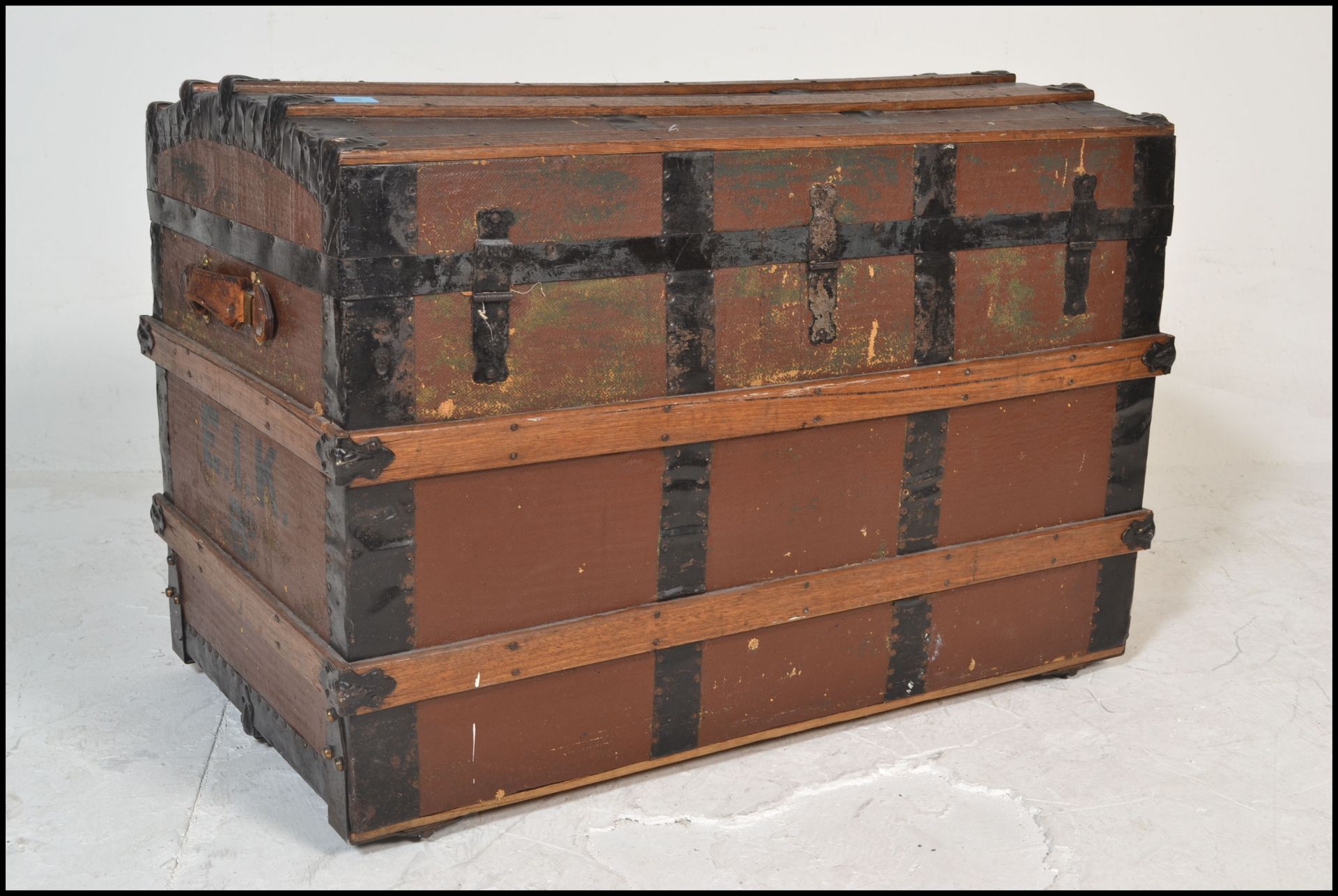 A Victorian 19th century wooden and canvas bound large dome top steamer trunk. Brown canvas with