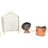 A selection of 19th Century fireside items to include a brass fire grate, a copper coal scuttle