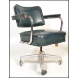 An industrial vintage 20th Century factory work revolving desk chair, over stuffed seat pad and