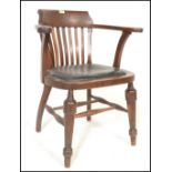 An early 20th Century Edwardian oak office elbow chair / armchair with slatted back and leather