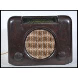 A vintage 1940's bakelite Bush radio type DAC. 90. having central round speaker with tuning and