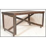 A stunning vintage 20th Century industrial factory trolley having a planked wooden top raised on a