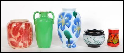 A group of four vases dating from the 19th Century to include Lovatts Langley of bulbous form