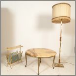 A vintage 20th Century onyx topped circular coffee table, the flared top raised on a gilt metal base