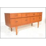A mid 20th Century retro teak wood sideboard / credenza having a set of short drawers  atop deep