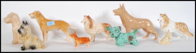 A collection of vintage 20th Century ceramic dog figurines by Sylvac to include a 1930's Terrier