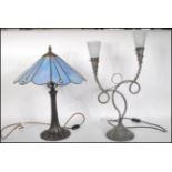An antique style Tiffany type table lamp with naturalistic column base having stained and leaded