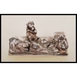 A silver hallmarked Thomas Charles Jarvis ornament depicting three bears having a picnic. Hallmarked