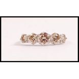 An 18ct white gold ladies dress ring set with five brilliant cut diamonds. Weight 3.3g. Diamonds
