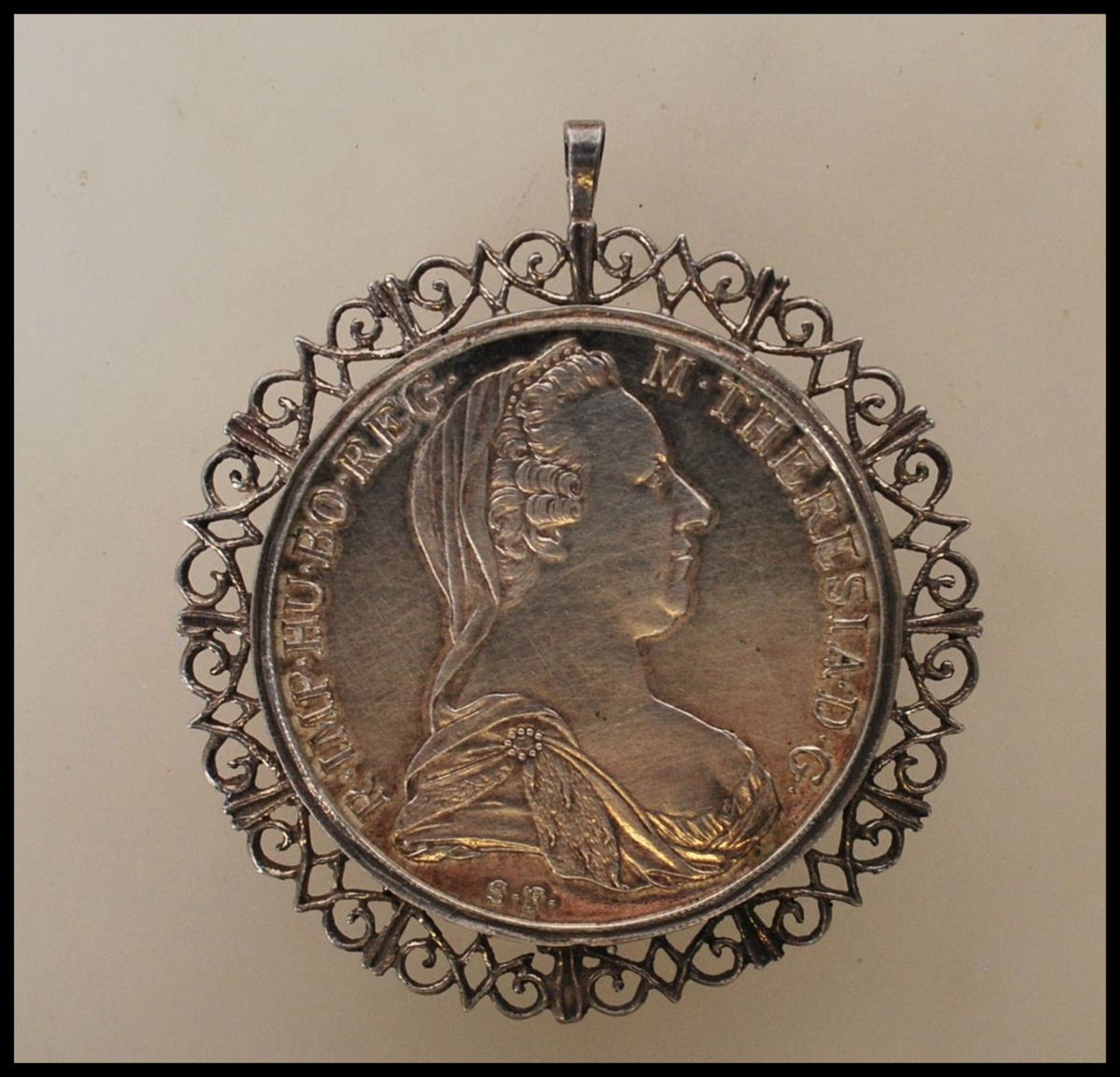 A silver Maria Theresa Silver Thaler coin, bearing