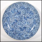 A 18th Century Chinese Kangxi Qing dynasty large dish / charger plate, decorated with blue and white
