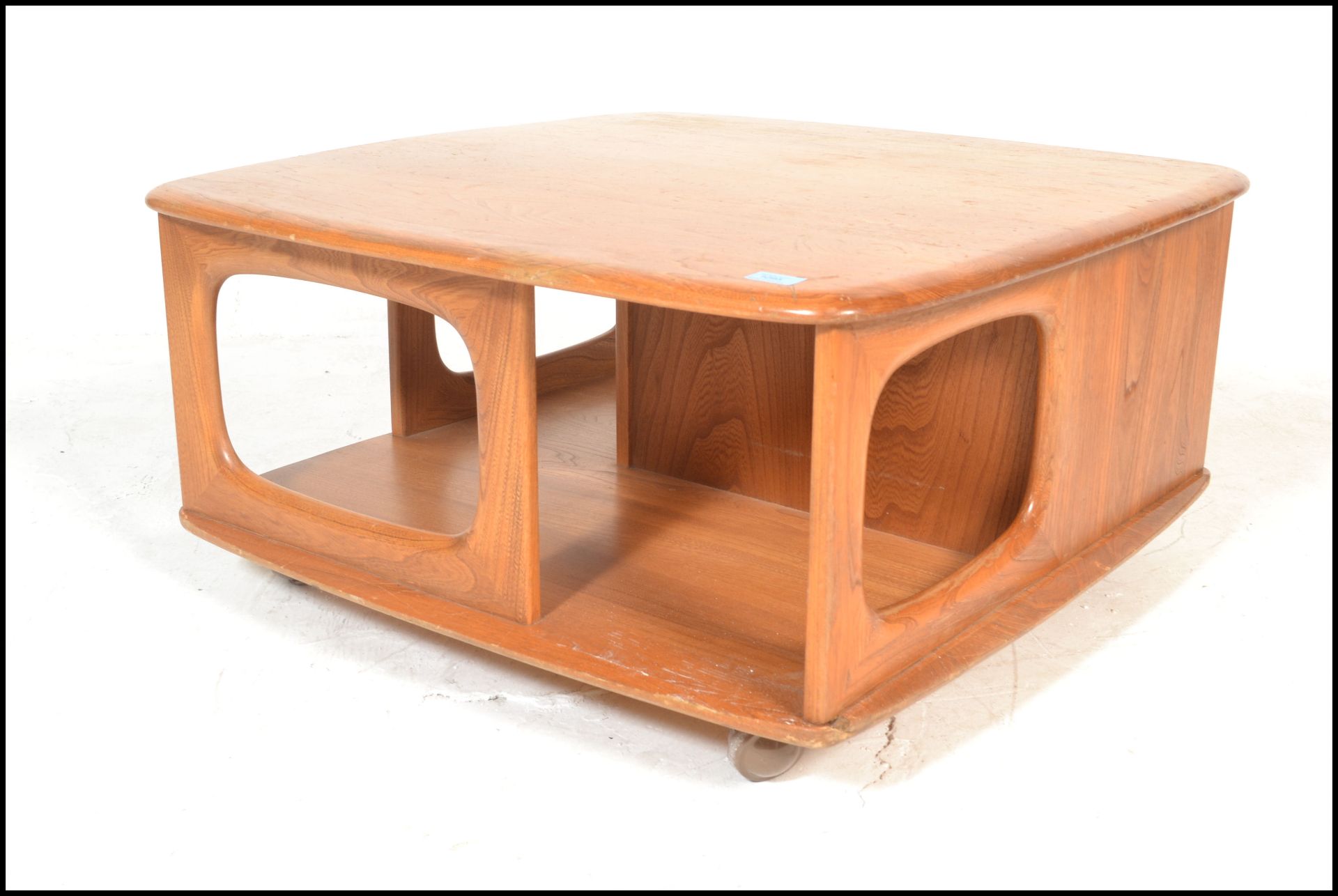 An original 20th Century retro Ercol elm wood Golden Dawn Pandora coffee table with storage recesses