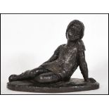 Karin Jonzen (1914-1998), bronzed resin sculpture of a girl reclining. Signed with initials KJ to