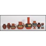 A collection of late 19th Century Terracotta Prattware consisting of; a Pratt ware Jug with