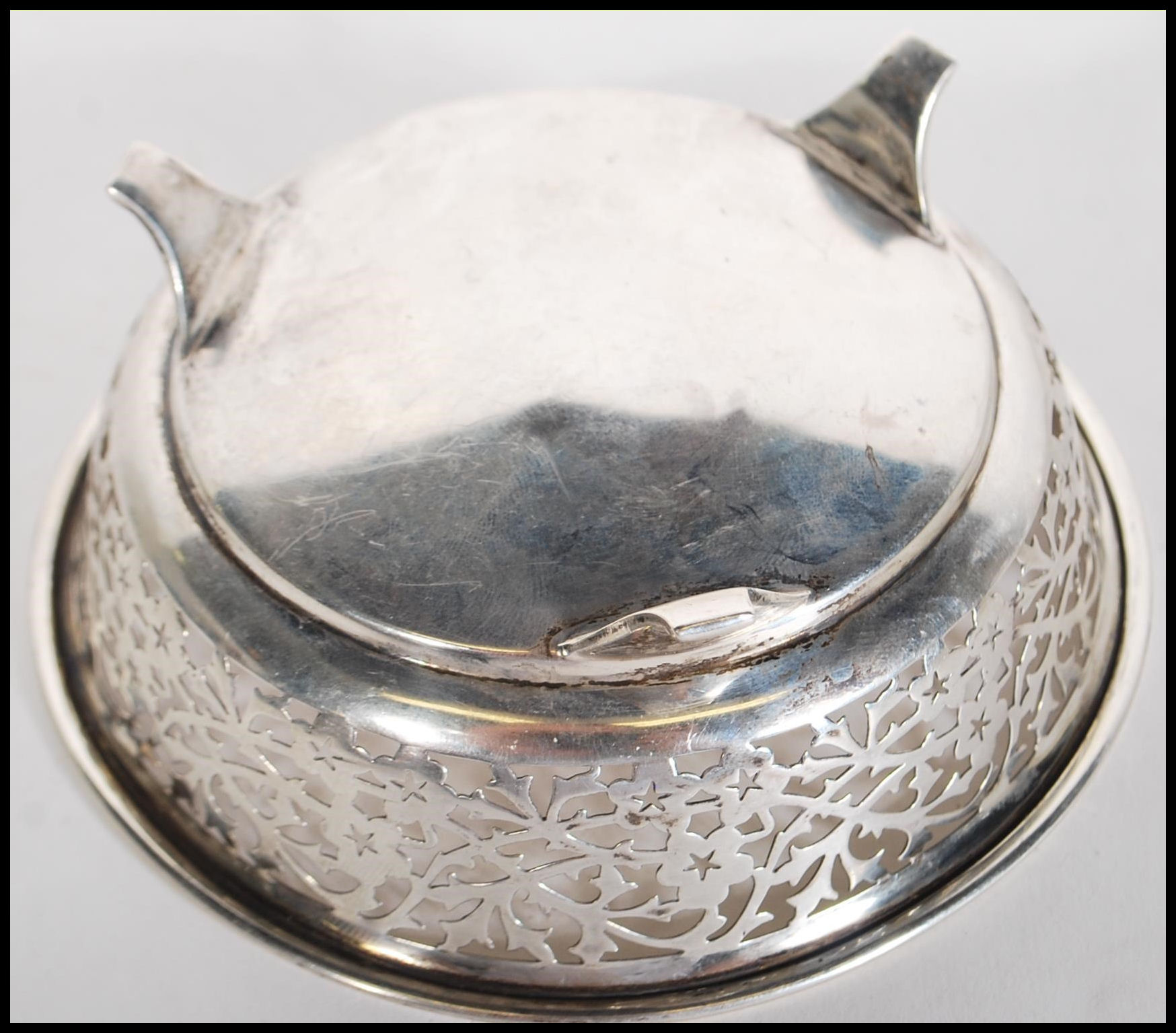 A early 20th Century silver hallmarked dish having pierced foliate decoration raised on three - Image 5 of 6