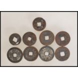 A group of nine Chinese tang dynasty coins having square pierced centres. Nine in total.