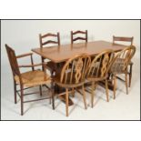 An early 20th century golden oak refectory dining table. Raised on twin square column end supports