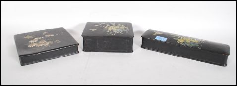 A group of three early 20th Century 1920's Chinese lacquered boxes having hand painted floral and