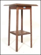 A 19th century Victorian Century carved mahogany  tier side / lamp  table having a square top with