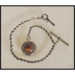 A 20th Century silver Albert pocket watch chain of rope twist design having T-bar and clasp end.