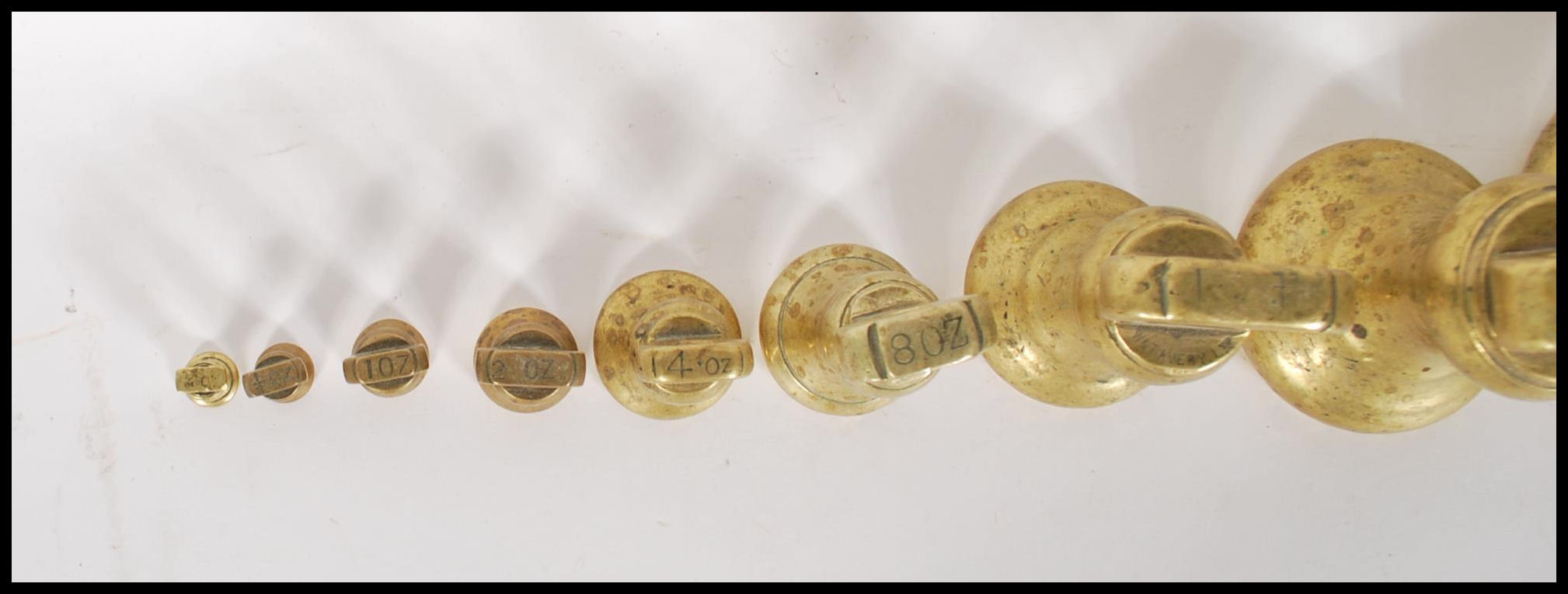 A selection of 20th century graduating brass bell weights having carrying handles atop, with the - Image 7 of 7