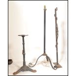 A collection of vintage metal stands to include a vintage cast metal bubble gum stand, an iron pub