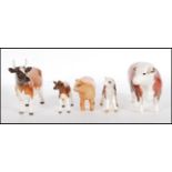 A collection of Beswick ceramic figurines modelled as cows and calves to include CH Ickham, Highland