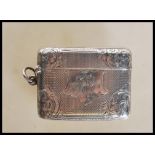 A 19th Century Victorian silver hallmarked vesta case having engine turned and floral engraved