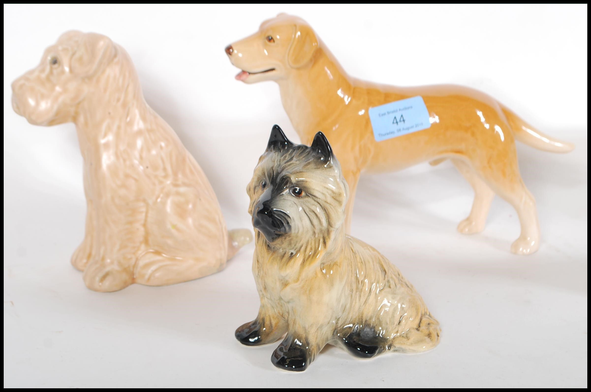 A collection of vintage 20th Century ceramic dog figurines by Sylvac to include a 1930's Terrier - Image 2 of 7