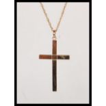 A hallmarked 9ct gold crucifix pendant on a stamped 375 chain. Crucifix hallmarked Sheffield. Weight