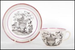 A 19th Century commemorative tea cup and saucer for the Memory Of Princess Charlotte, having black