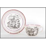 A 19th Century commemorative tea cup and saucer for the Memory Of Princess Charlotte, having black