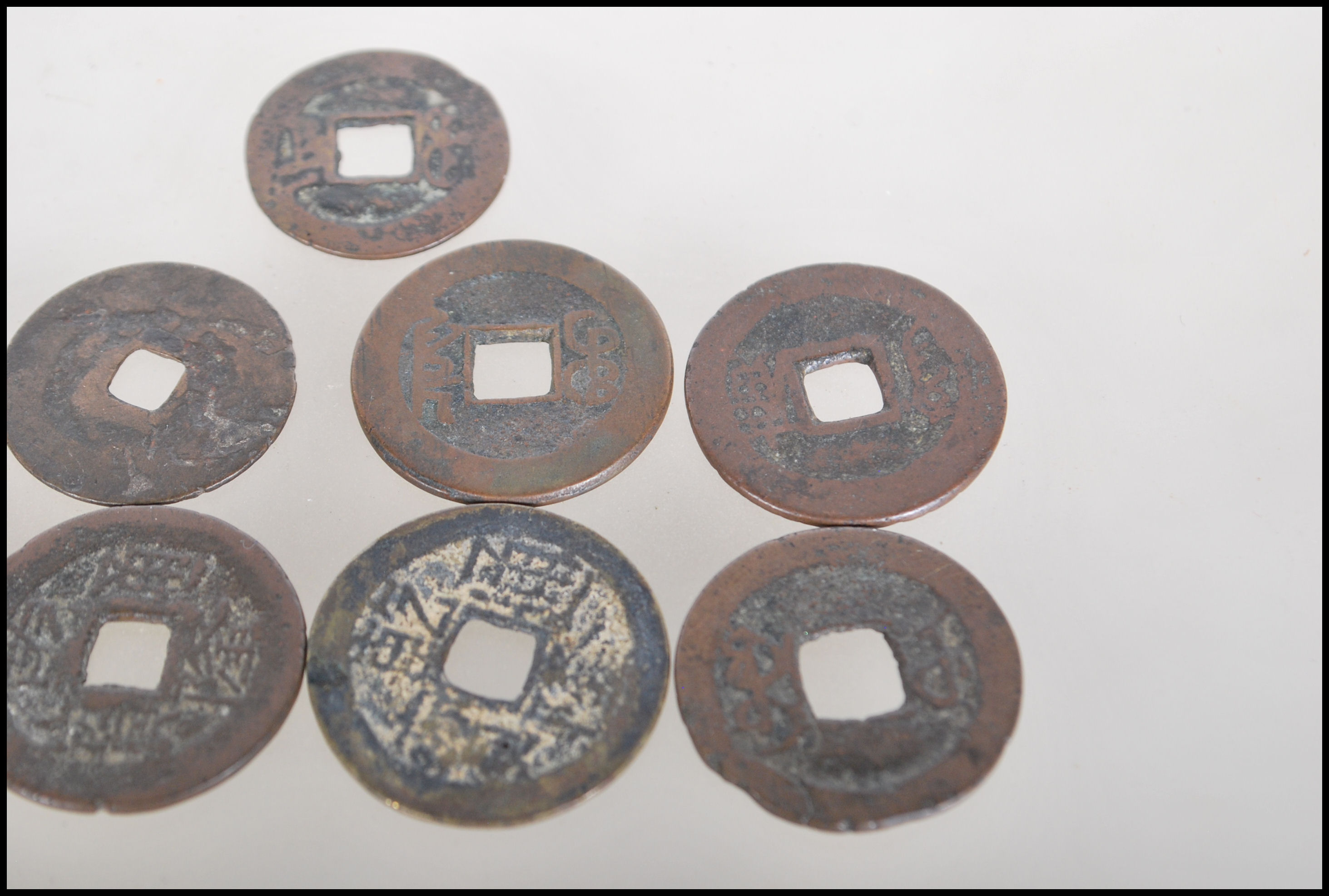 A group of nine Chinese tang dynasty coins having square pierced centres. Nine in total. - Image 4 of 7