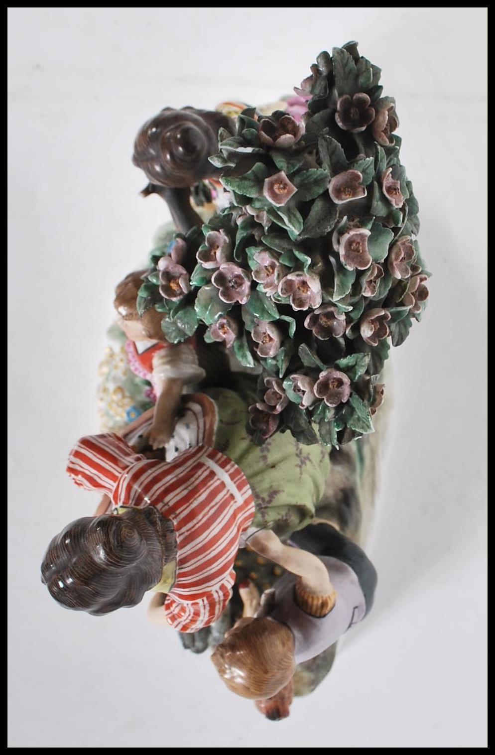 A late 19th Century Continental ceramic figurine group in the manner of Meissen. The group - Image 5 of 9