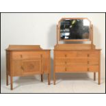 A late 19th / early 20th Century high Victorian light oak dressing chest having large swing