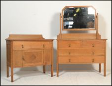 A late 19th / early 20th Century high Victorian light oak dressing chest having large swing