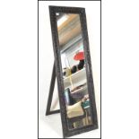A large freestanding bedroom antique style Versailles type easel mirror. Full size with carved