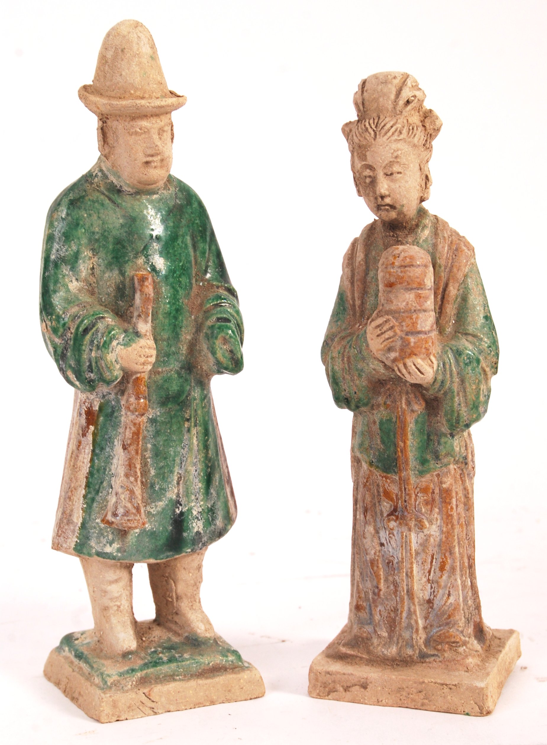 A pair of antique Chinese Ming dynasty (1368 – 1644) glazed pottery figures / tomb attendants in the