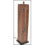 A stunning floor standing light / lamp, created from a 19th Century oak gate post set to a square