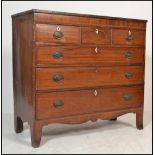 A Georgian early 19th century mahogany chest of drawers having 3 short drawers over graduating